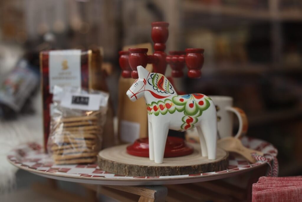 Swedish dala horse and other items on table