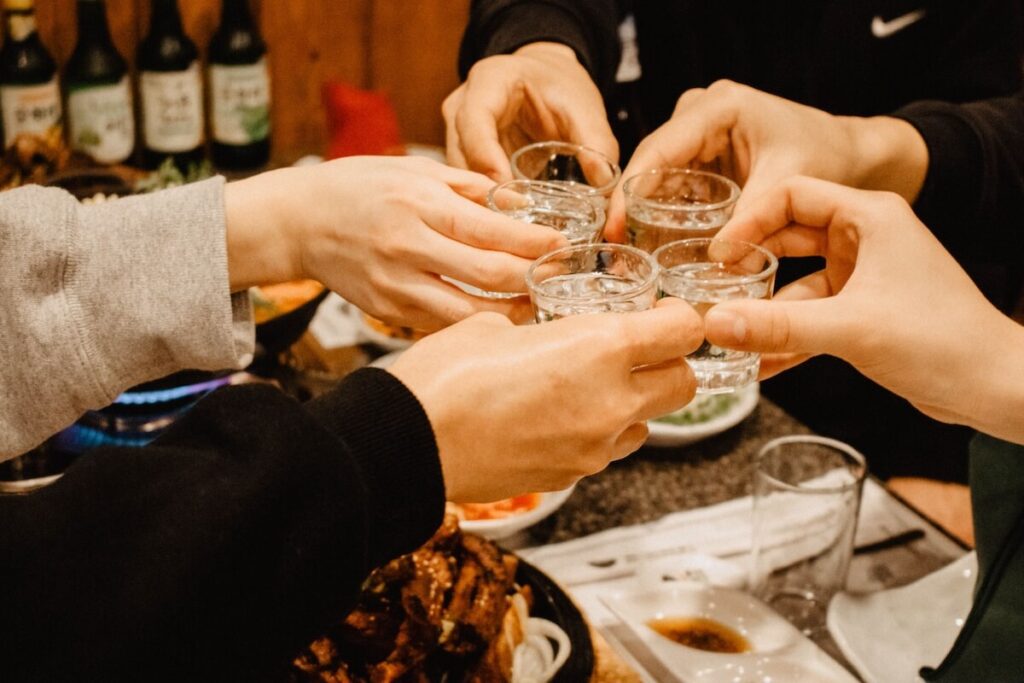 friends clink glasses