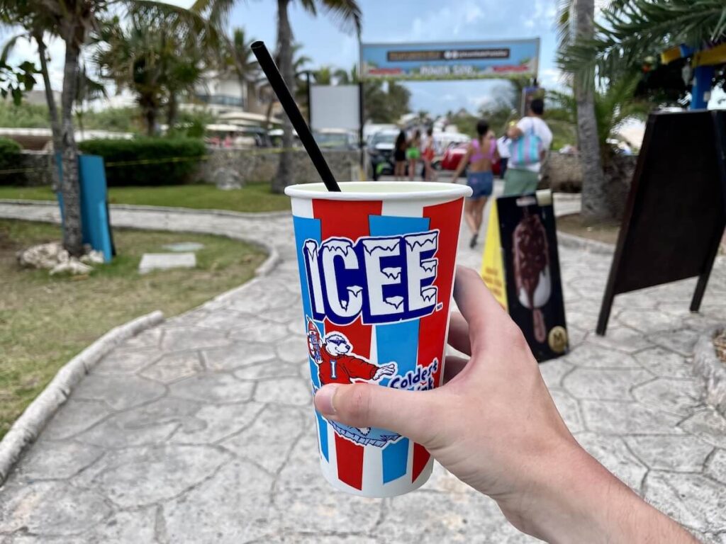 person holding cup of ICEE slushie