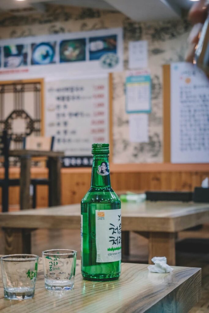 soju bottle and glasses on table