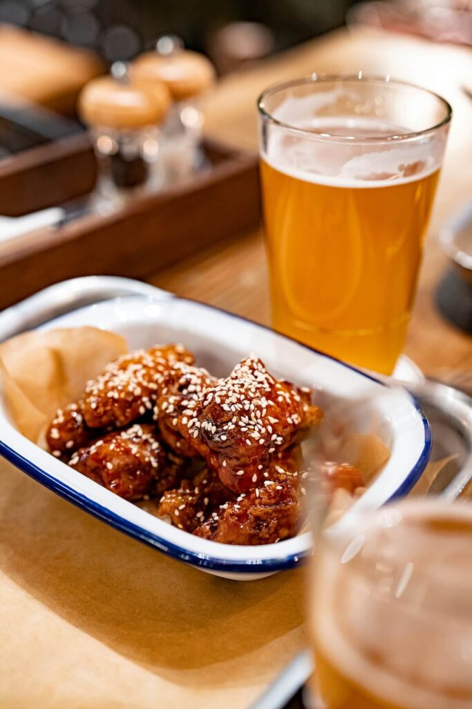 Korean fried chicken and glass of draft beer