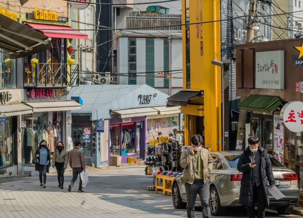 people walking along shopping street in Itaewon